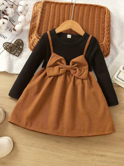 Discover the Charming Velvet Bow Dress for kids. Perfect for winter festivities, combining comfort, style, and practicality. Shop now at Toosly.