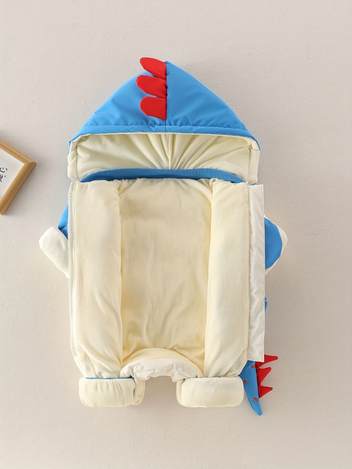 Discover warmth and fun with the Cozy Dino Baby Winter Romper. Perfect for chilly outings, designed for comfort and joy. Shop Toosly.