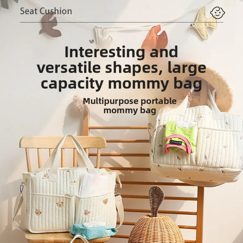Korean-style mommy bag with large capacity and quilted design. Lightweight, stylish, and perfect for travel or everyday baby care.