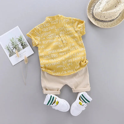 Trendy summer outfit for boys. Soft cotton letter shirt and comfy shorts — perfect for play, travel, and sunny days full of fun.