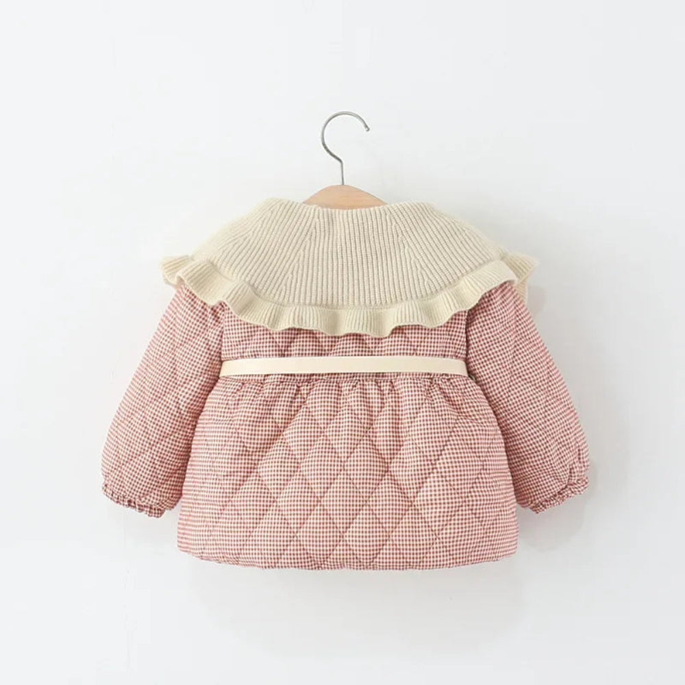 Warm plaid winter coat for girls. Soft cotton design with ruffle collar and belt — stylish, cozy, and perfect for chilly days.
