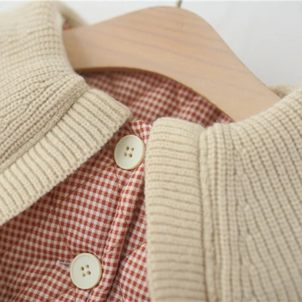 Warm plaid winter coat for girls. Soft cotton design with ruffle collar and belt — stylish, cozy, and perfect for chilly days.
