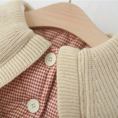 Warm plaid winter coat for girls. Soft cotton design with ruffle collar and belt — stylish, cozy, and perfect for chilly days.
