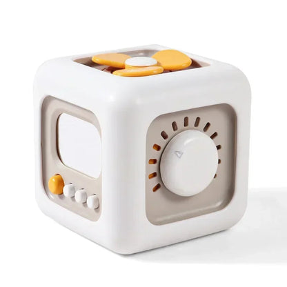 6-in-1 Montessori busy cube for toddlers. Safe, sensory toy that builds focus, coordination, and problem-solving through hands-on play.

