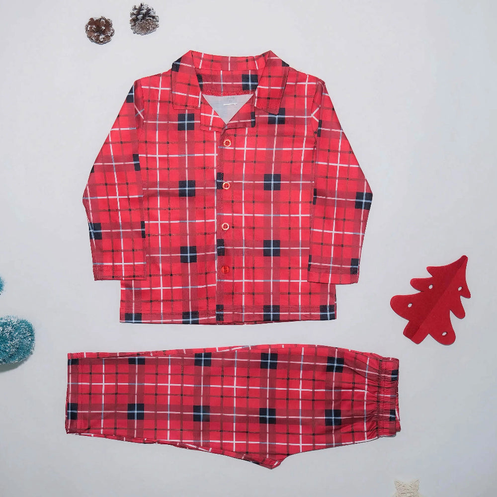 High-quality plaid family Christmas pajamas. Soft button-up set for adults and kids, perfect for cozy winter nights and festive photos.