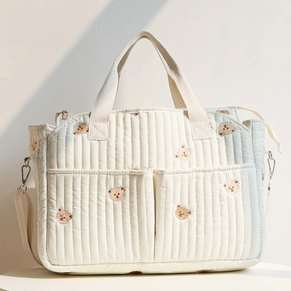 Korean-style mommy bag with large capacity and quilted design. Lightweight, stylish, and perfect for travel or everyday baby care.