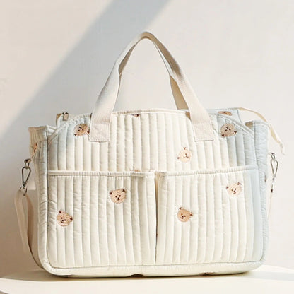 Korean-style mommy bag with large capacity and quilted design. Lightweight, stylish, and perfect for travel or everyday baby care.