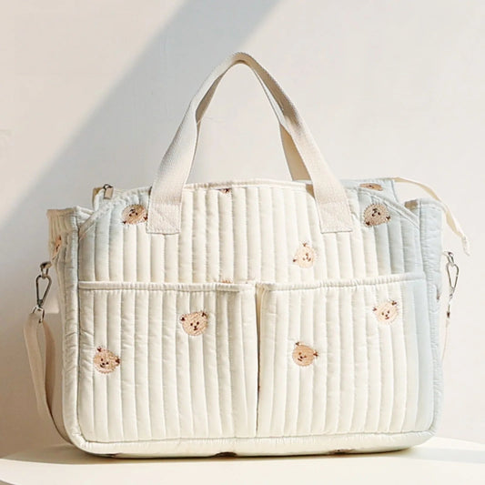Korean-style mommy bag with large capacity and quilted design. Lightweight, stylish, and perfect for travel or everyday baby care.