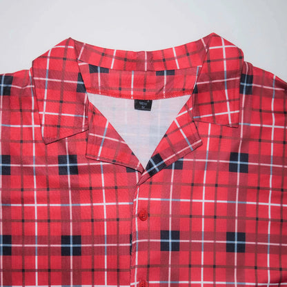 High-quality plaid family Christmas pajamas. Soft button-up set for adults and kids, perfect for cozy winter nights and festive photos.