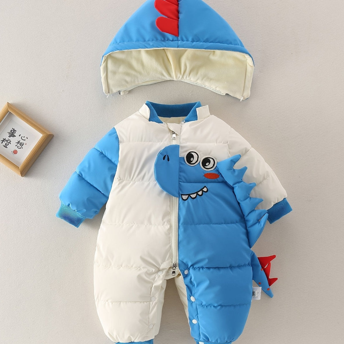 Discover warmth and fun with the Cozy Dino Baby Winter Romper. Perfect for chilly outings, designed for comfort and joy. Shop Toosly.