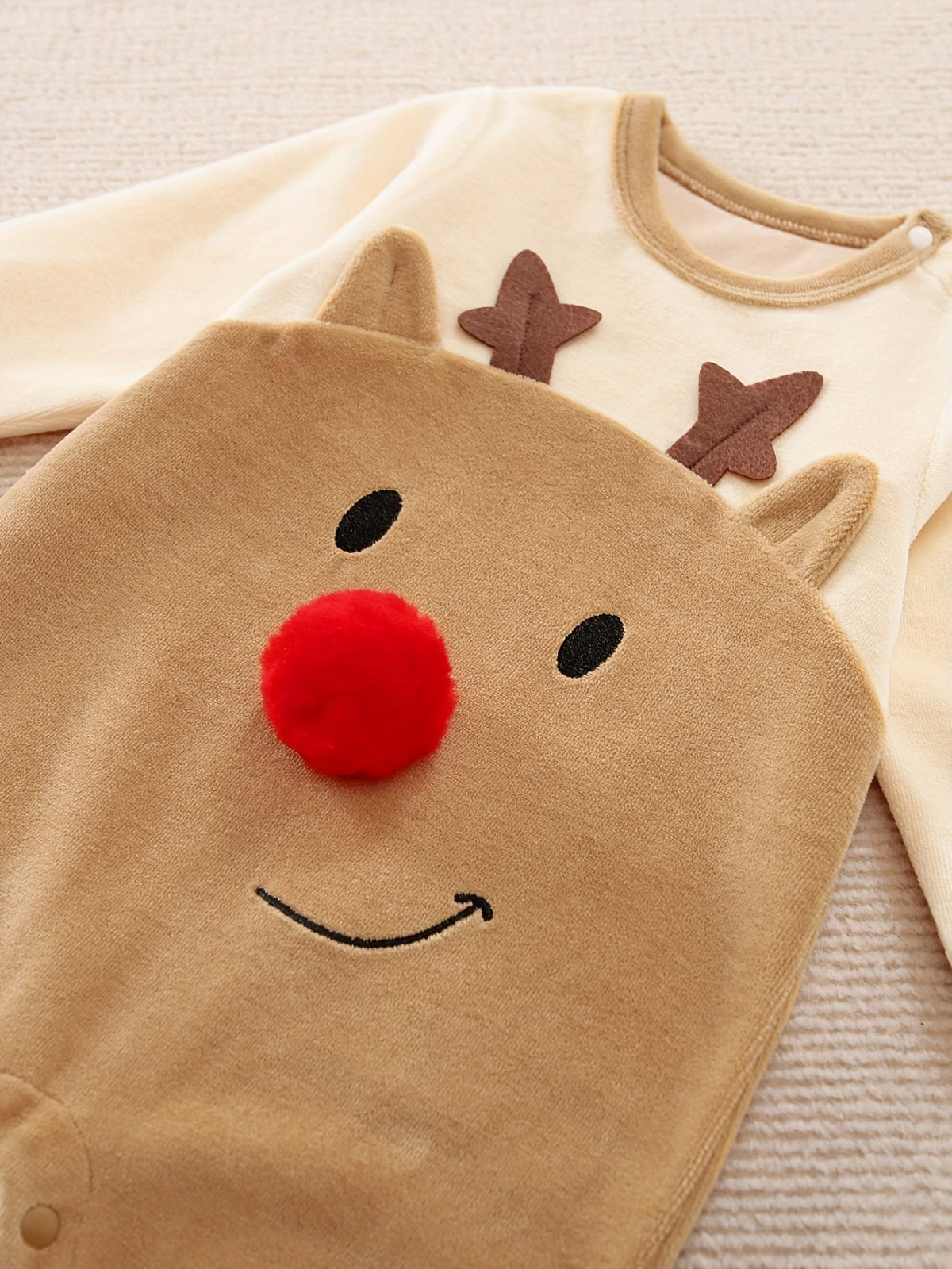 Discover the Cozy Reindeer Baby Jumpsuit at Toosly. Perfect for holiday warmth and fun. Soft, safe, and adorable.