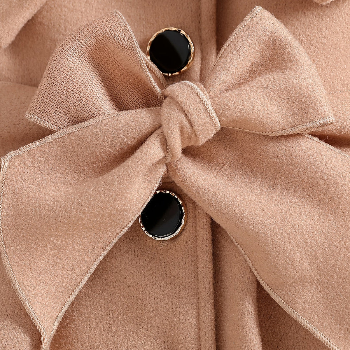 Keep your baby girl warm and stylish with our Winter Coat featuring a plush collar and bow. Perfect for chilly days.