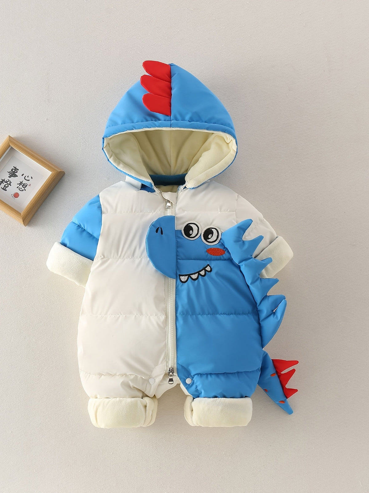 Discover warmth and fun with the Cozy Dino Baby Winter Romper. Perfect for chilly outings, designed for comfort and joy. Shop Toosly.