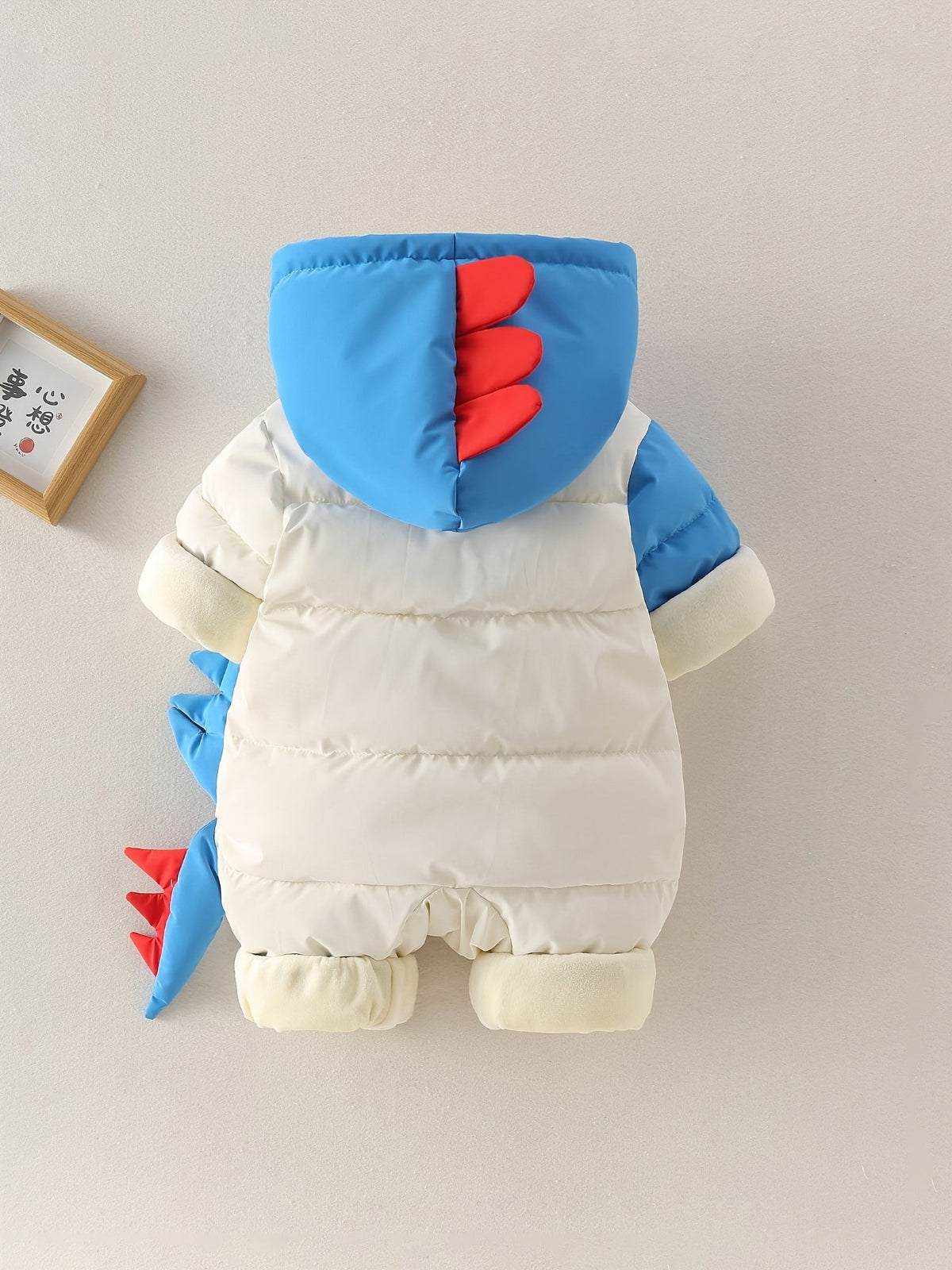 Discover warmth and fun with the Cozy Dino Baby Winter Romper. Perfect for chilly outings, designed for comfort and joy. Shop Toosly.