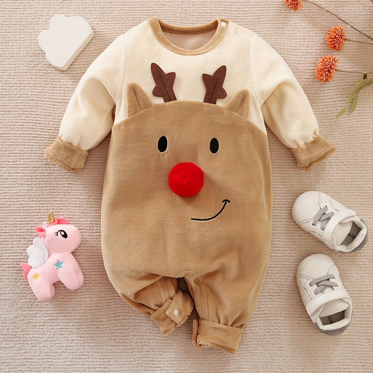 Discover the Cozy Reindeer Baby Jumpsuit at Toosly. Perfect for holiday warmth and fun. Soft, safe, and adorable.